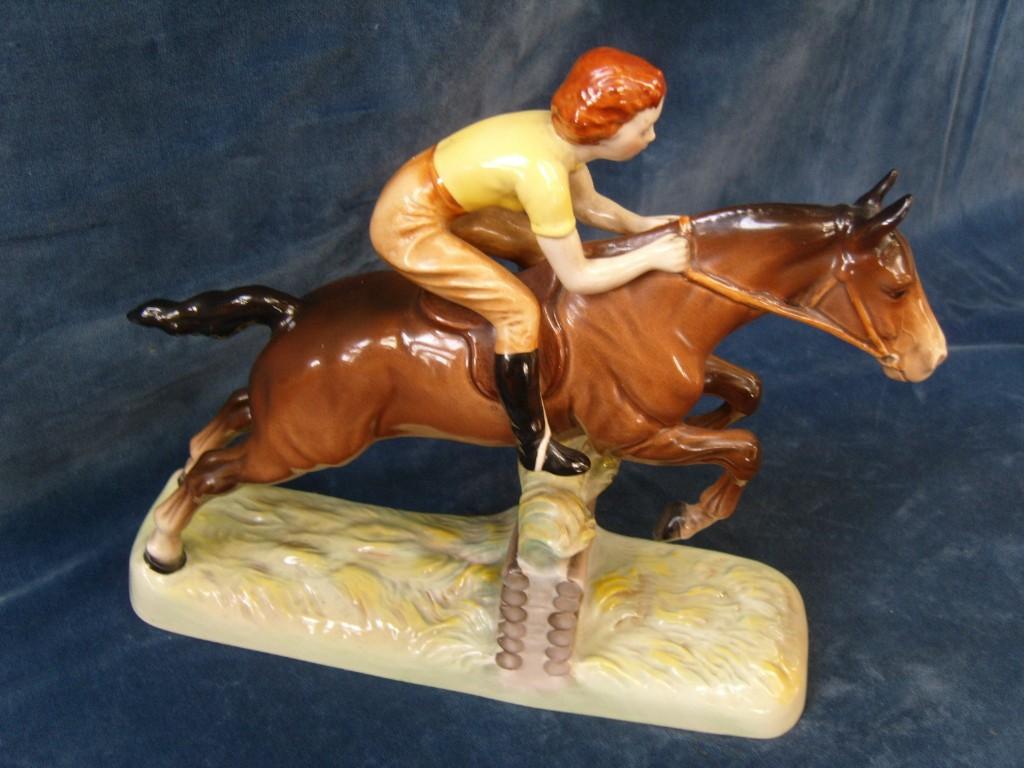 Appraisal: A Beswick model of a girl in yellow sweater and