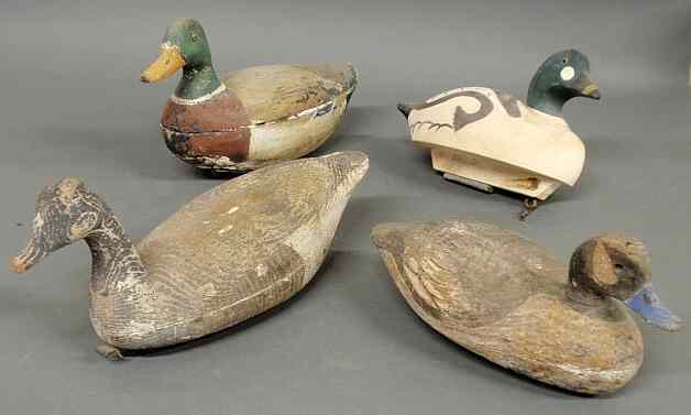 Appraisal: Three hollow-carved duck decoys largest l and a solid example