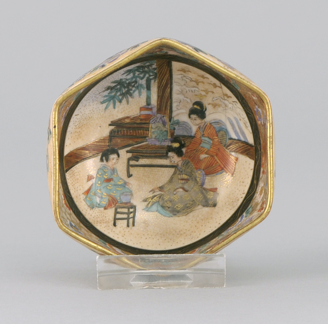 Appraisal: SATSUMA POTTERY TEACUP In hexagonal form Interior cartouche of ladies