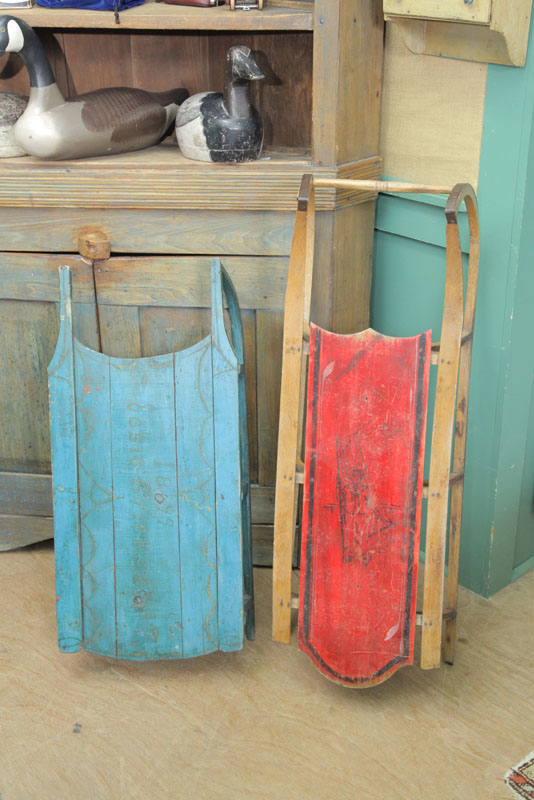 Appraisal: GROUP OF TWO PAINTED SLEDS One blue painted wooden sled