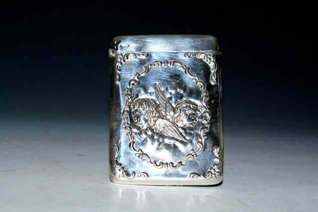 Appraisal: A LATE VICTORIAN SILVER CALLING CARD CASE EMBOSSED WITH CHERUBS