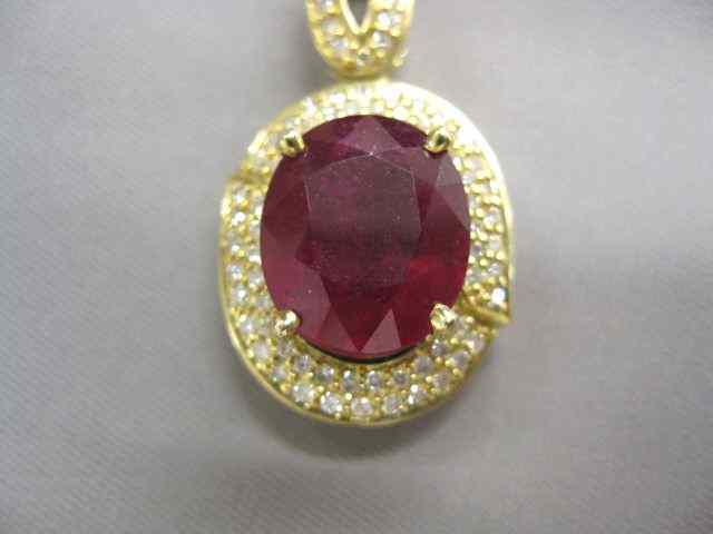 Appraisal: Ruby Diamond Pendant carat oval gem surrounded by diamonds totaling