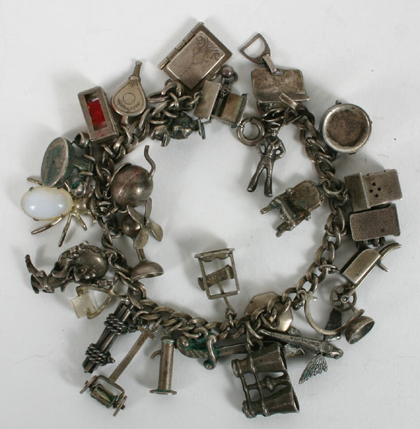 Appraisal: Vintage sterling charm bracelet holding approx charms most marked sterling