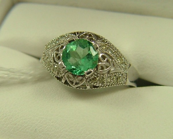 Appraisal: EMERALD AND DIAMOND RING K white gold setting estimated weight