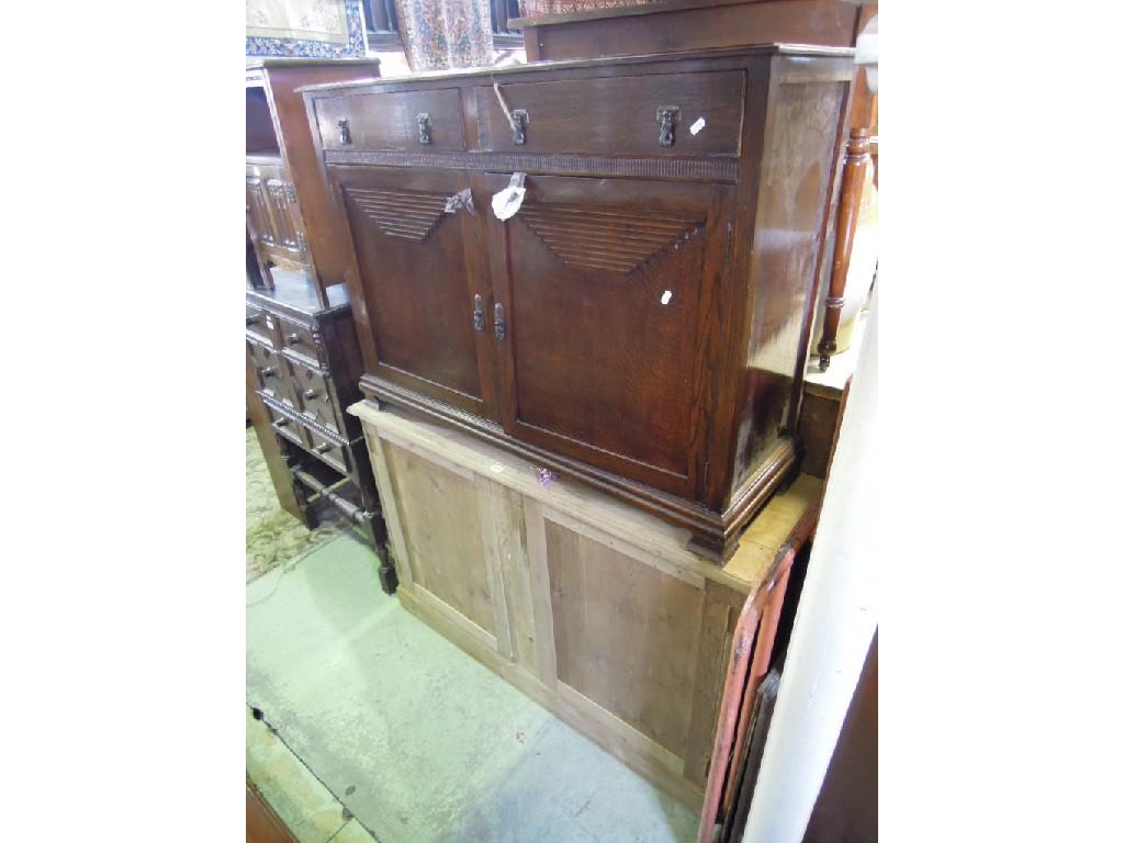 Appraisal: A stripped pine side cupboard enclosed by a pair of