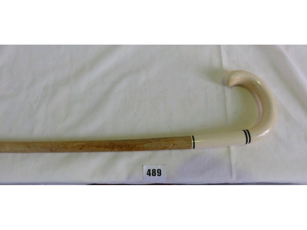 Appraisal: A walking stick with an ivory turned handle