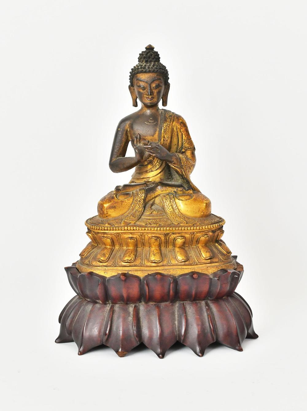 Appraisal: SINO-TIBETAN GILT AND PATINATED BRONZE BUDDHA th th Century Seated