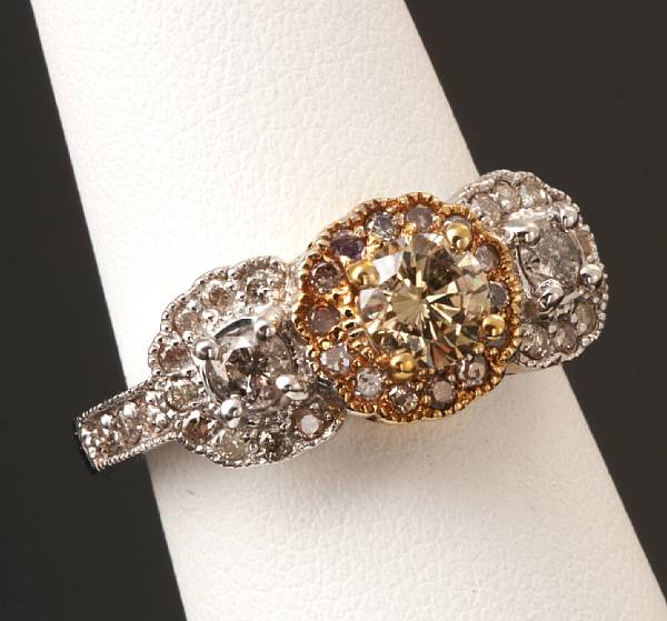 Appraisal: A diamond and k bicolor gold ring some stones damaged