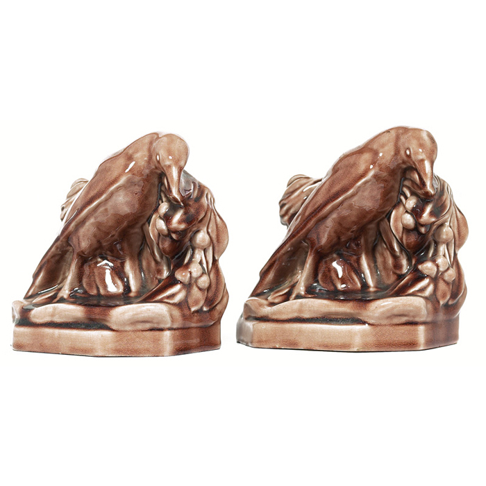 Appraisal: Rookwood bookends pair designed by William McDonald rooks covered in