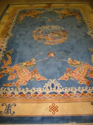 Appraisal: A CHINESE WASHED AND FRINGED RUG th century the central