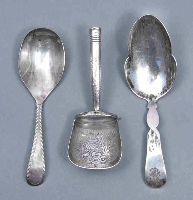 Appraisal: A GEORGE III SILVER CADDY SPOON with foliate engraved shovel