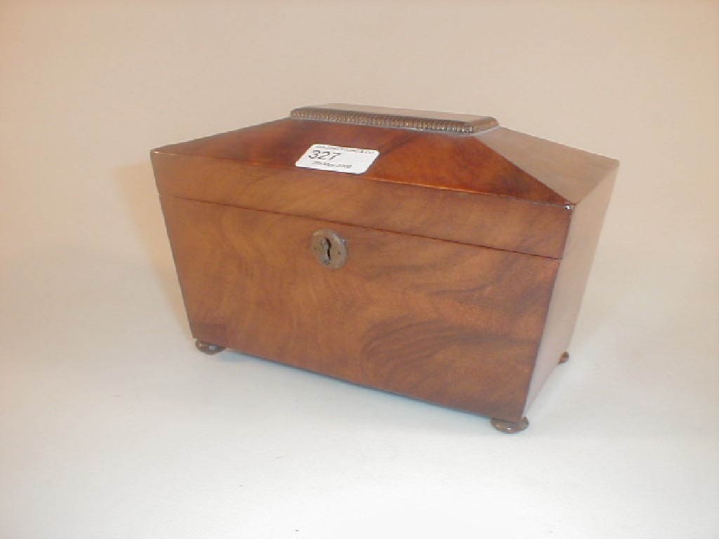 Appraisal: A Regency figured mahogany sarcophagus shaped tea caddy with bun