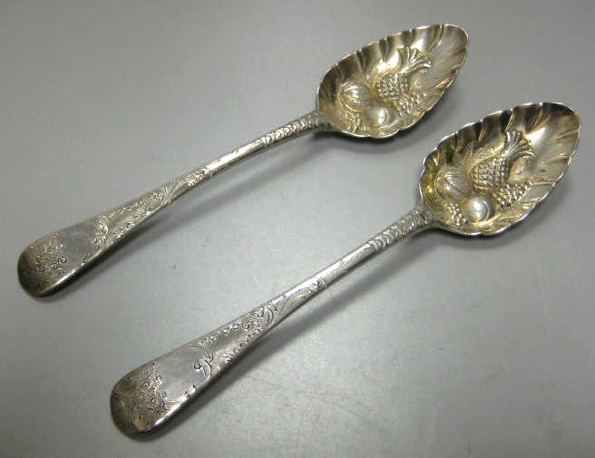 Appraisal: WILLIAM ELEY WILLIAM FEARN LONDON Two English silver berry spoons