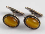 Appraisal: Georg Jensen A pair of silver and amber cufflinks by