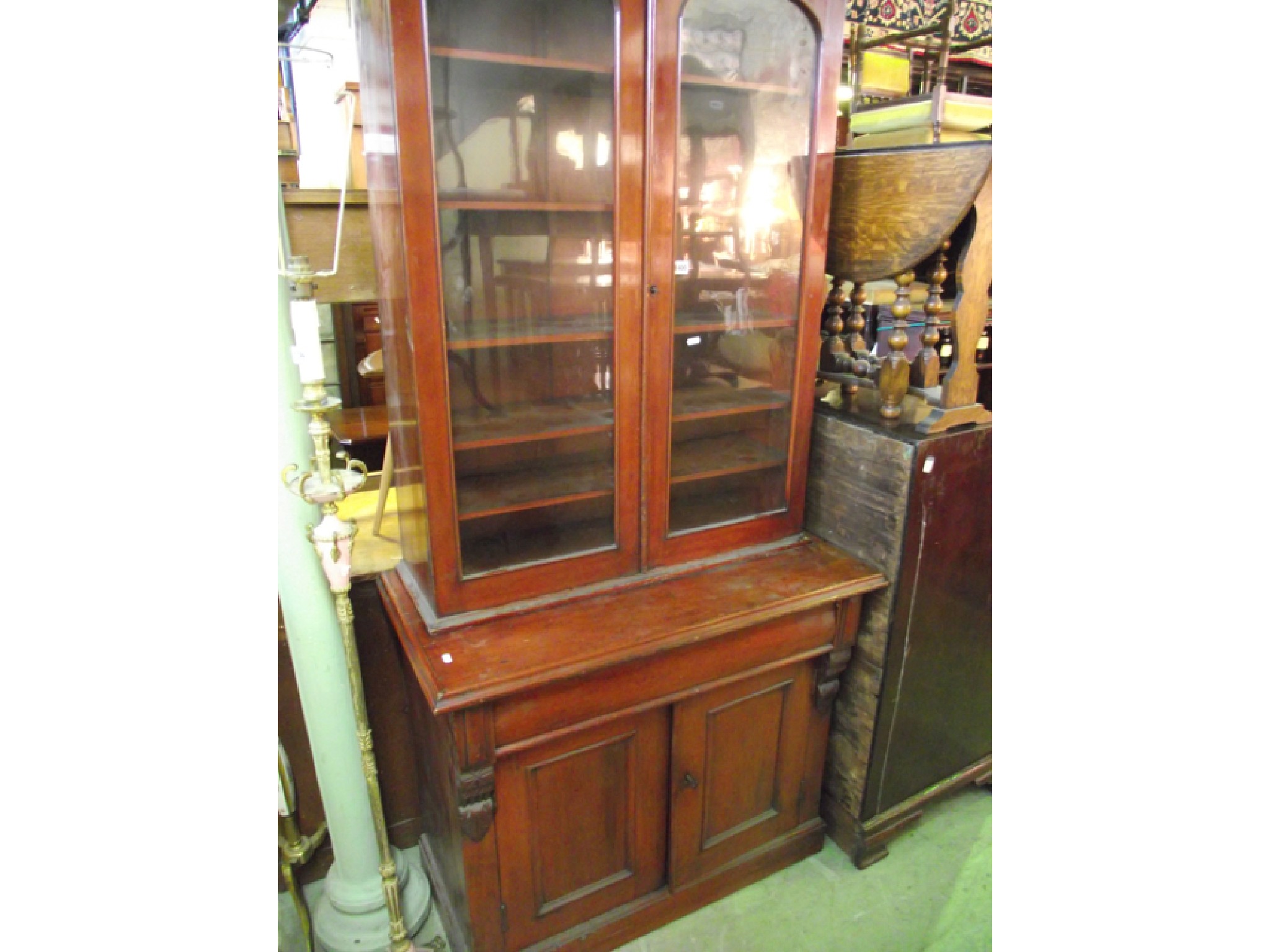 Appraisal: A Victorian pine library bookcase the lower section enclosed by