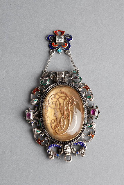 Appraisal: AN AUSTRO-HUNGARIAN PENDANT with inset cypher and in a scrolled