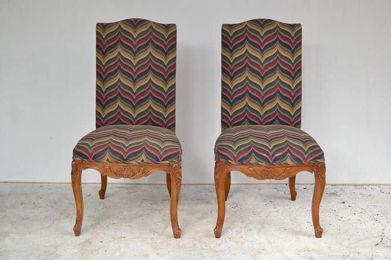 Appraisal: A PAIR OF FRENCH PROVINCIAL STYLE CHAIRS IN MASONI FABRIC