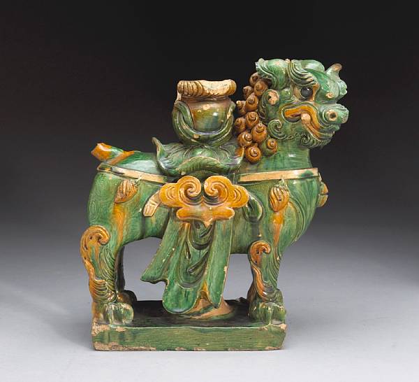 Appraisal: A sancai glazed pottery model of a caparisoned lion th