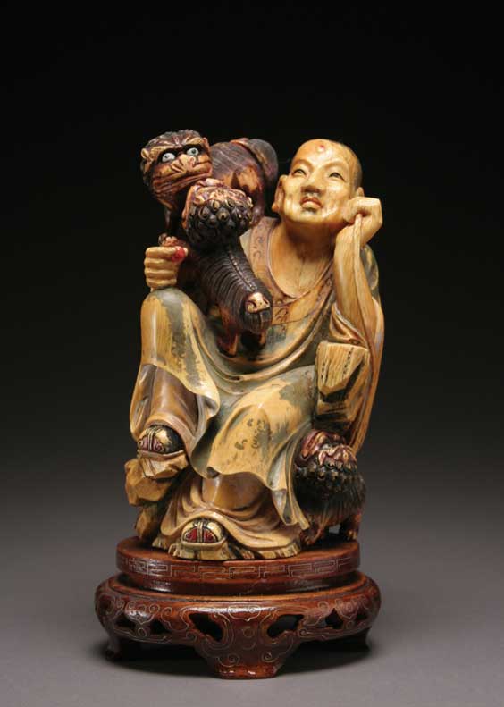 Appraisal: POLYCHROMED IVORY LOHAN Chinese carved and polychromed ivory seated Lohan