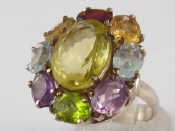 Appraisal: A silver multi gem ring the central citrine measuring approx