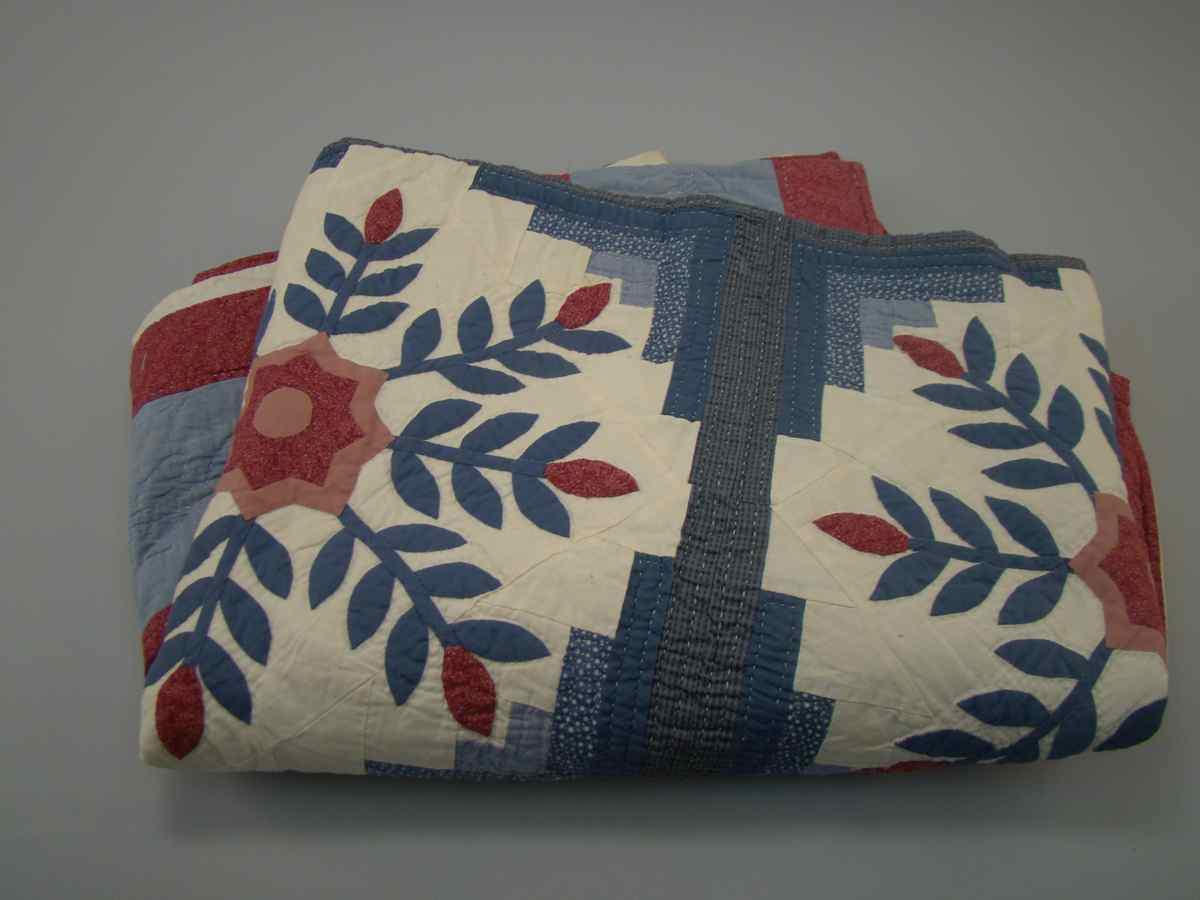 Appraisal: BLUE WHITE AND RED QUILT th CenturyIn geometric design with