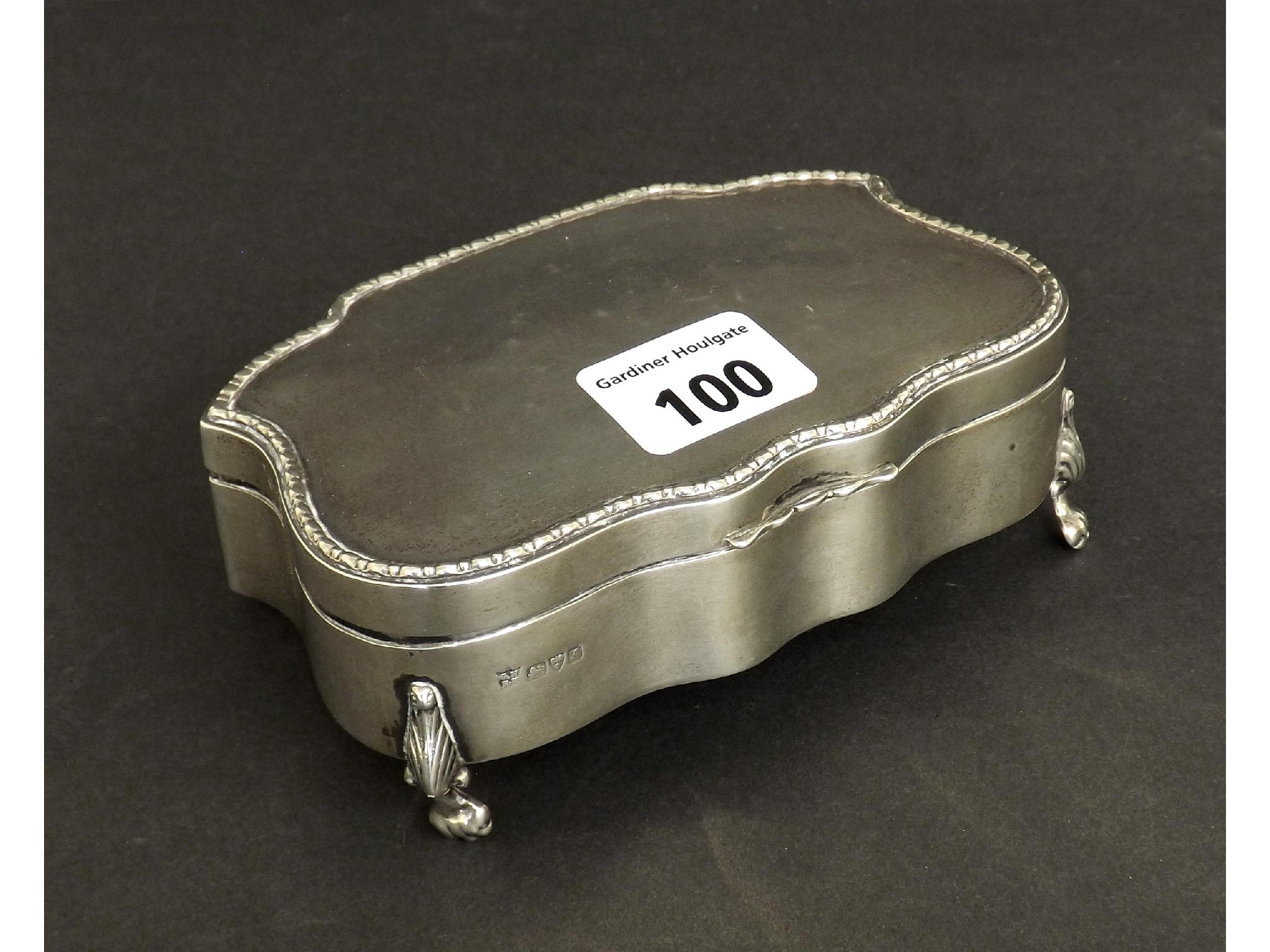 Appraisal: Edwardian silver serpentine trinket box with beaded rim and fancy