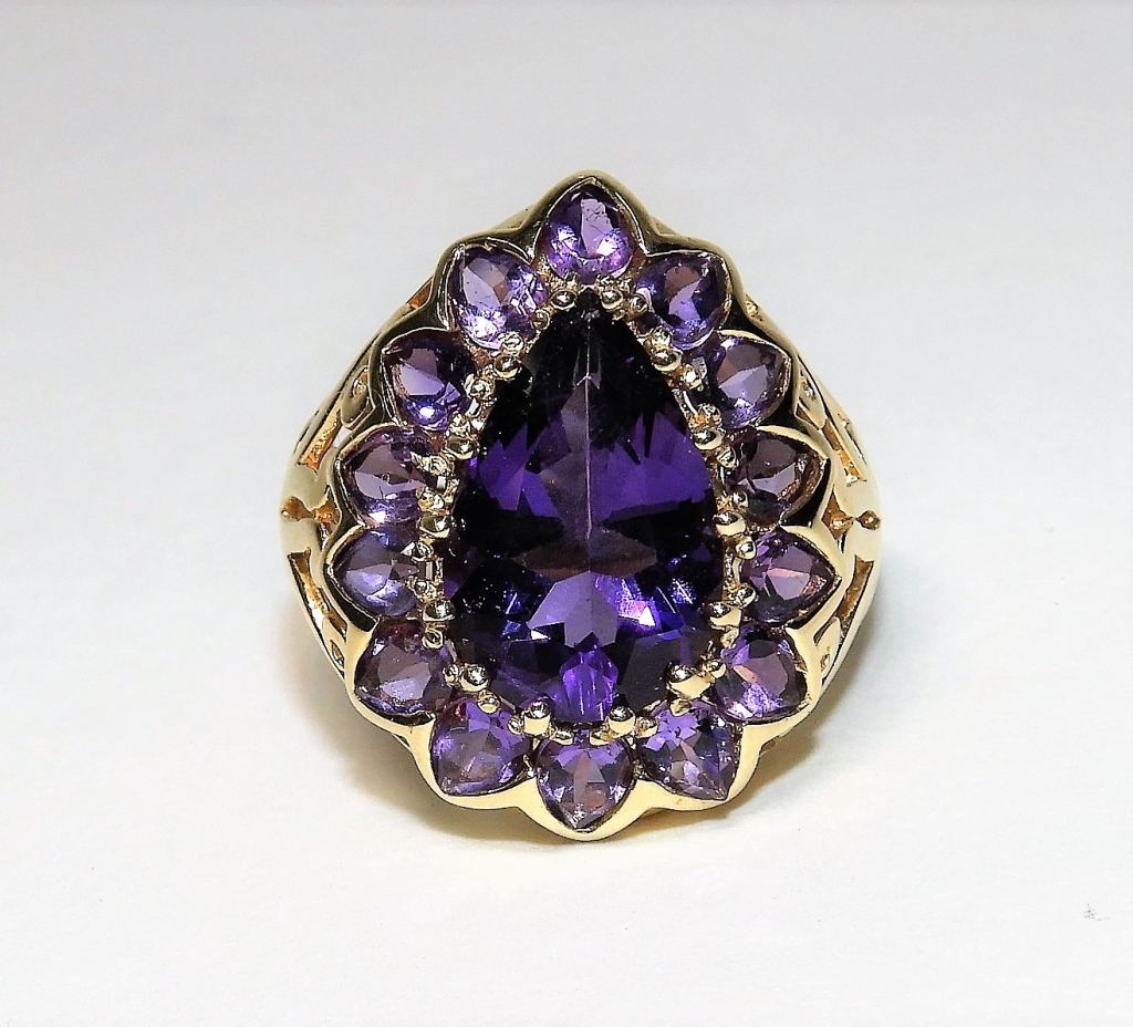 Appraisal: K YELLOW GOLD AMETHYST CLUSTER COCKTAIL RING ContemporaryLarge pear shape