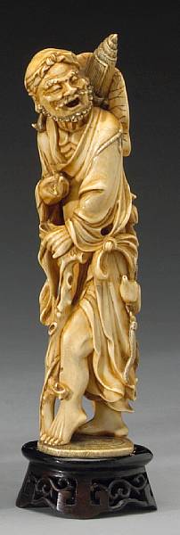 Appraisal: A tinted ivory figure of Li Tiegui th Century The