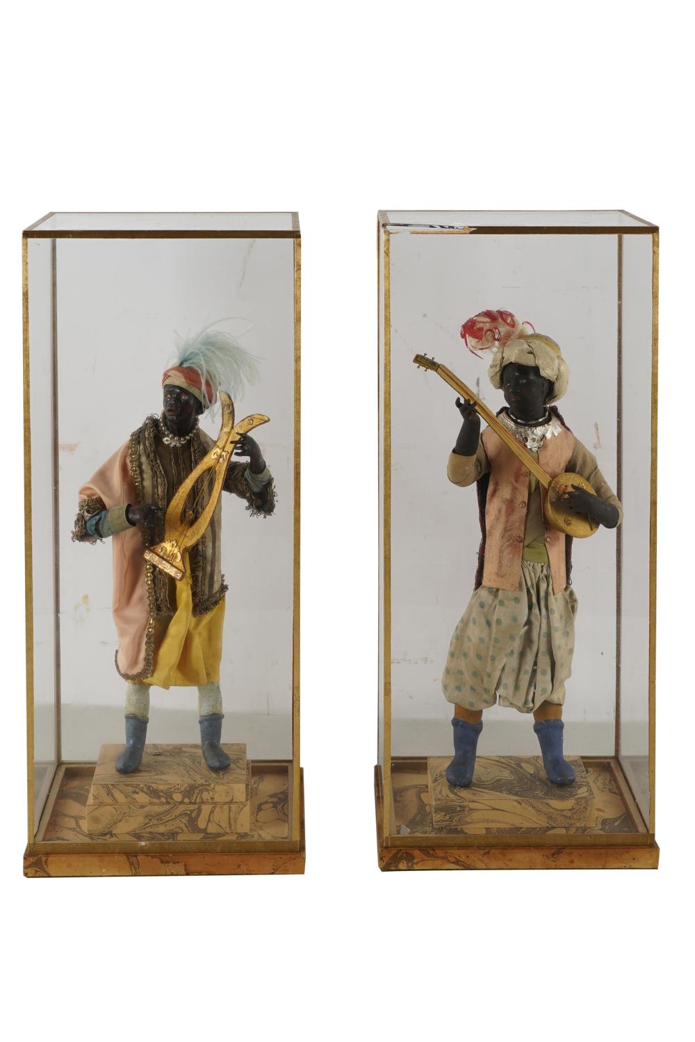 Appraisal: PAIR OF VENETIAN BLACKAMOOR MUSICIANSCondition one case with broken glass