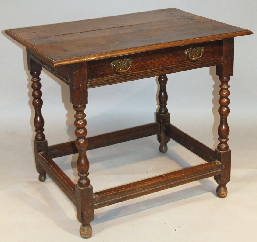 Appraisal: A principally thC oak side table the rectangular overhanging top