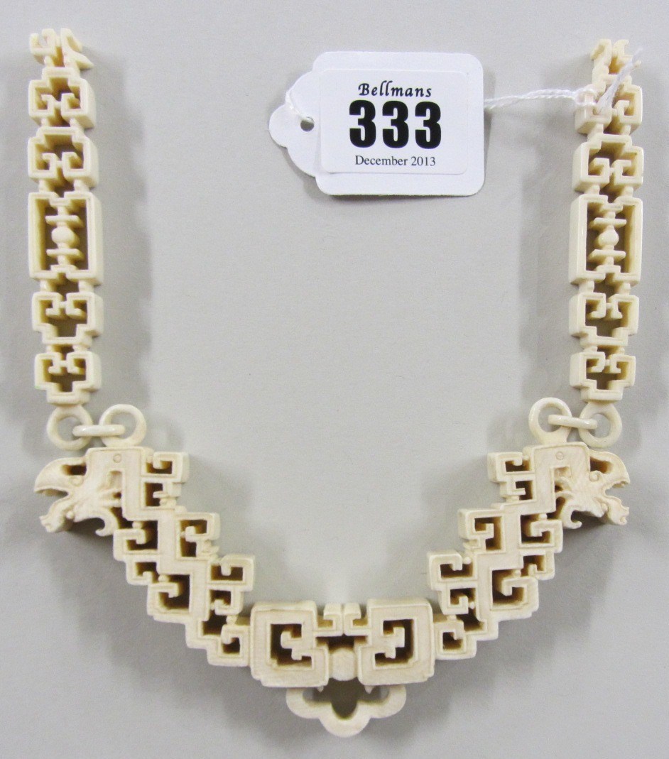 Appraisal: A Canton ivory hanging chain th century of arched form