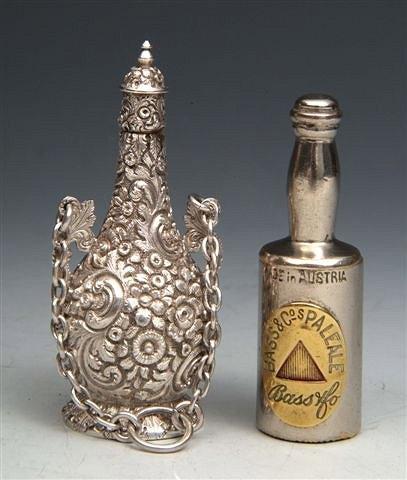 Appraisal: A METAL VESTA CASE in the form of a bottle