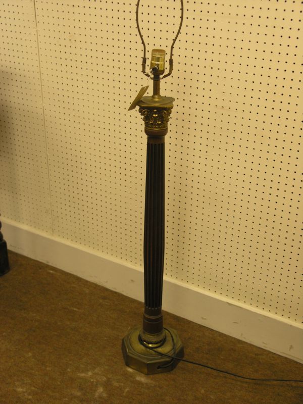 Appraisal: A mahogany and brass floor lamp with brass corinthian capital