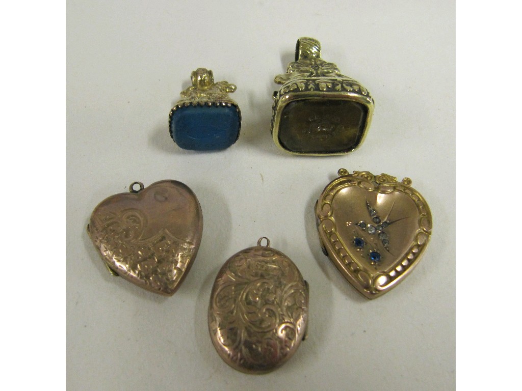 Appraisal: Lot comprising three rolled gold photo locket and two stone