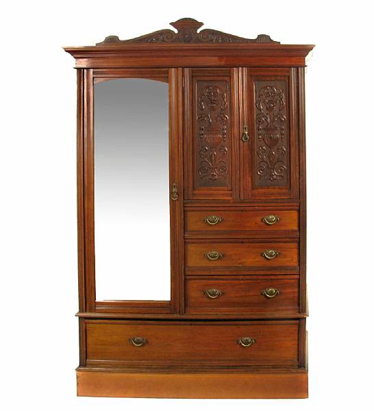 Appraisal: A Victorian carved walnut wardrobe height ft in width ft