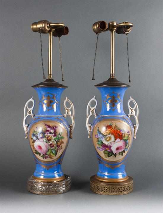 Appraisal: Pair of Porcelain de Paris floral painted double-handled urns mounted