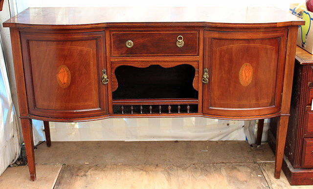 Appraisal: AN EDWARDIAN LINE INLAID TWIN DOMED FRONT SIDEBOARD with conch