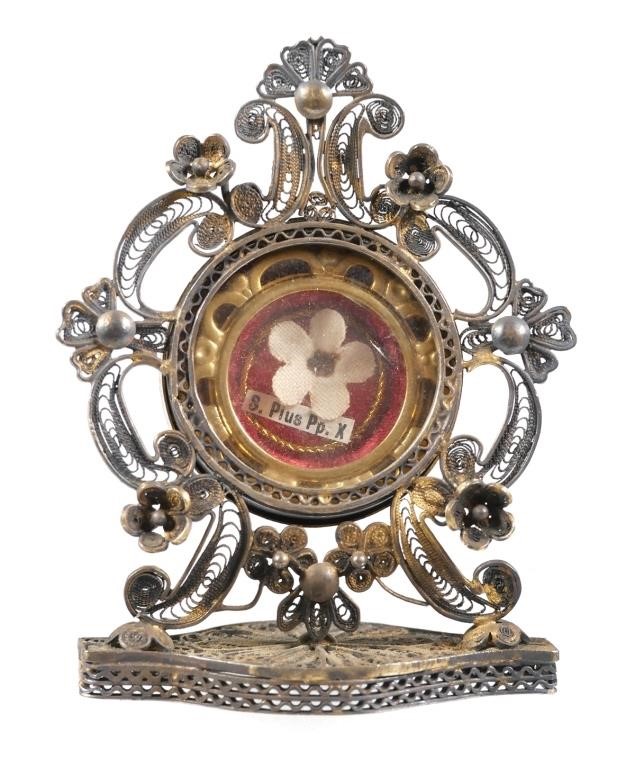 Appraisal: Circa relic holder in intricate silver filigree housing a small