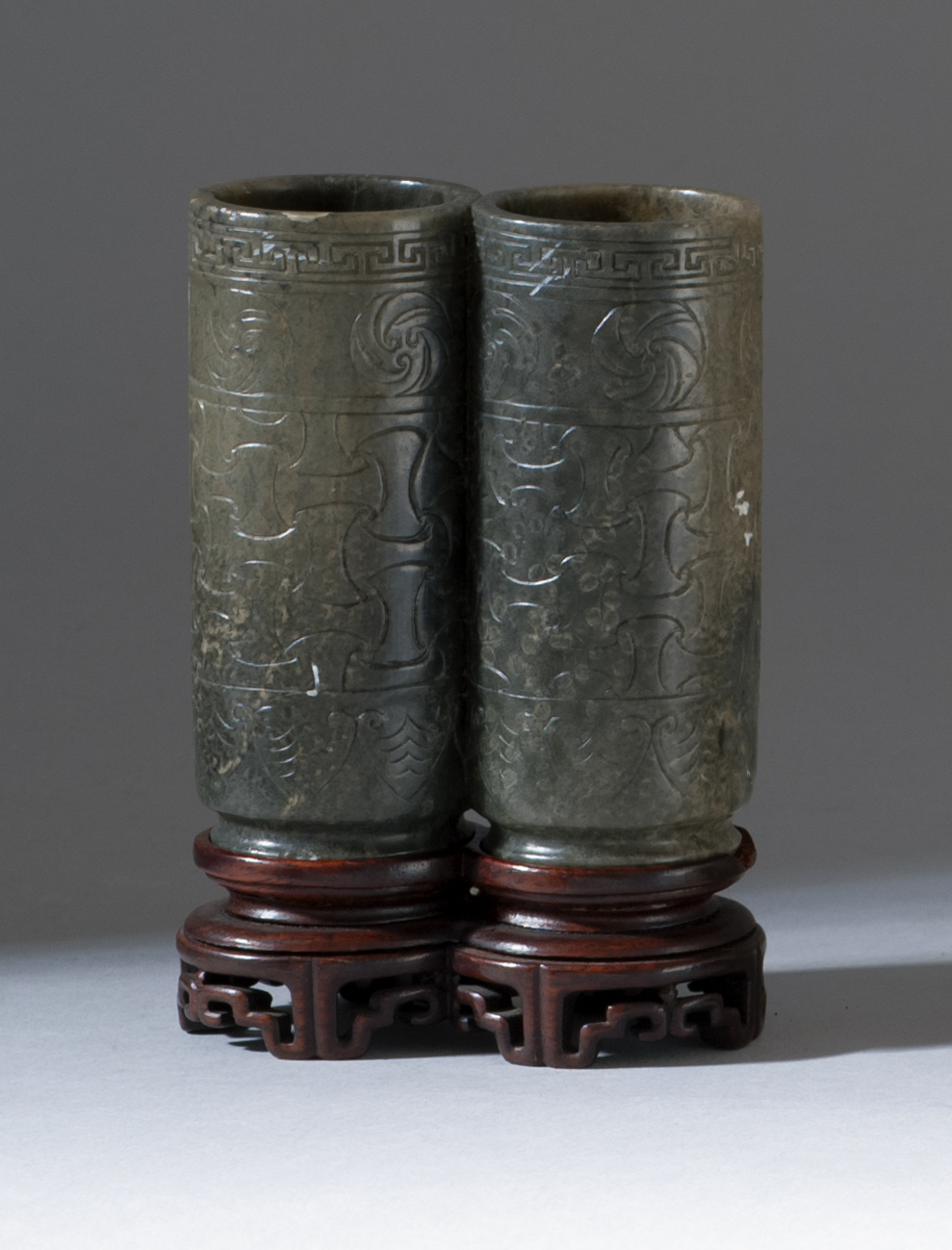 Appraisal: SAGE-GREEN JADE DOUBLE VASE th CenturyIn cylinder form with basketry