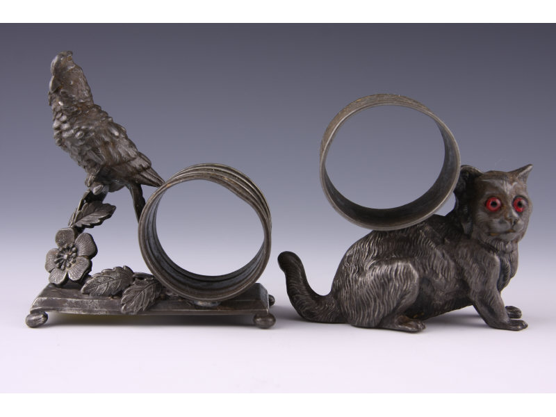 Appraisal: Two Meriden Silverplate Figural Napkin Rings the first a cat