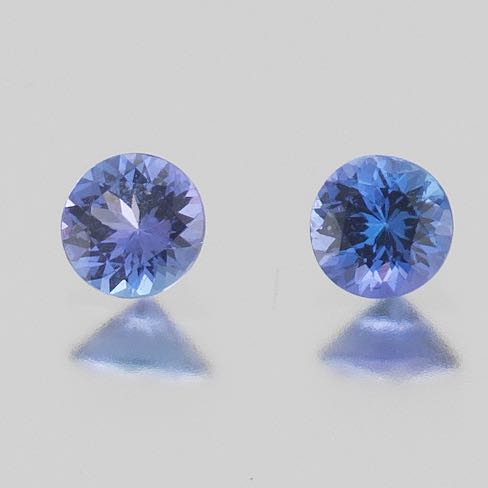 Appraisal: TWO UNMOUNTED CT TOTAL ROUND CUT TANZANITE GEMSTONES Two unmounted