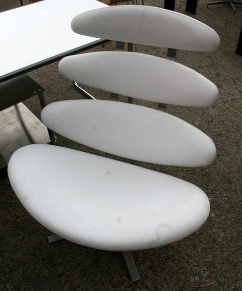 Appraisal: A pair of white leather and aluminium chairs after