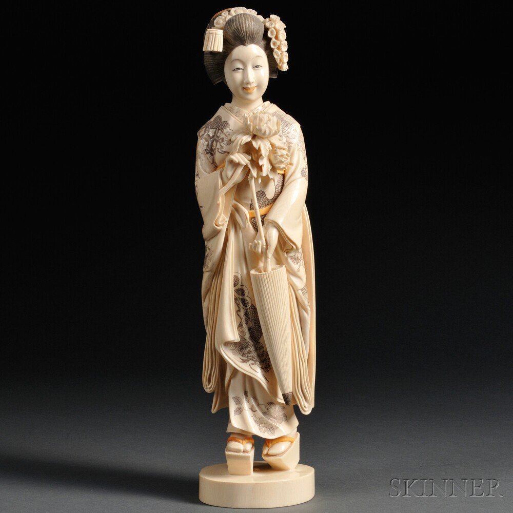 Appraisal: Ivory Okimono of a Courtesan Japan th century standing with