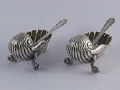 Appraisal: A pair of late Victorian silver shell salts on dolphin