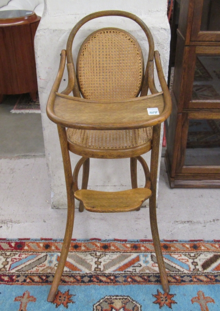 Appraisal: BENTWOOD INFANT HIGHCHAIR Austrian c having an oval caned back