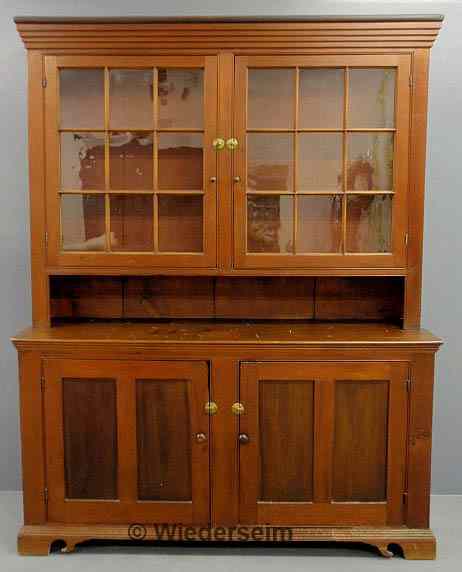 Appraisal: Pennsylvania German pine two-piece Dutch cupboard c with a molded