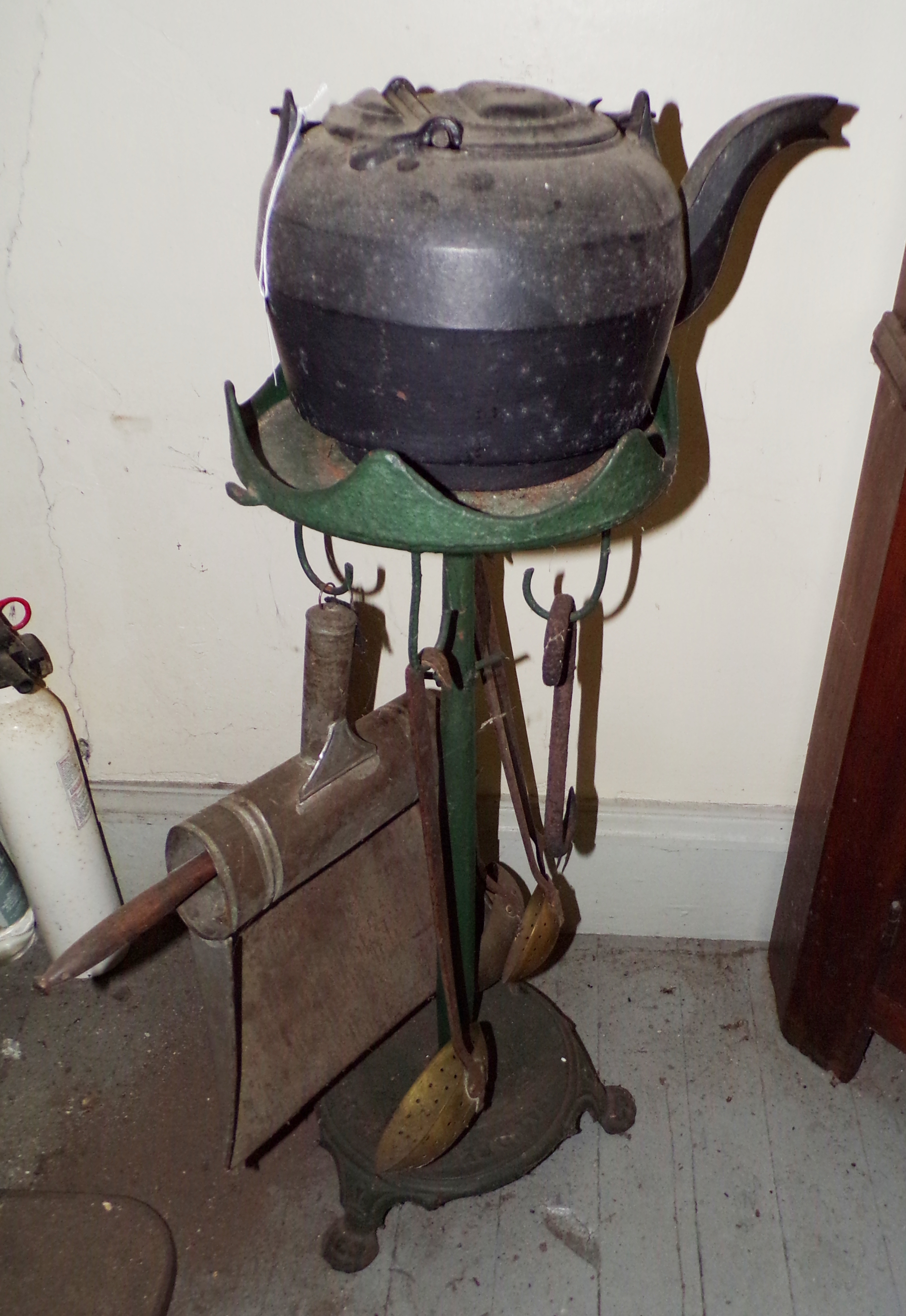 Appraisal: S Watt cast iron stand with kitchen implements ''h