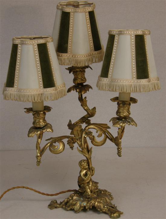 Appraisal: th century French gilt three branch candelabra the naturalistic form