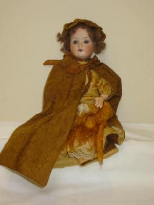 Appraisal: An F W Goebel bisque head girl doll with blue