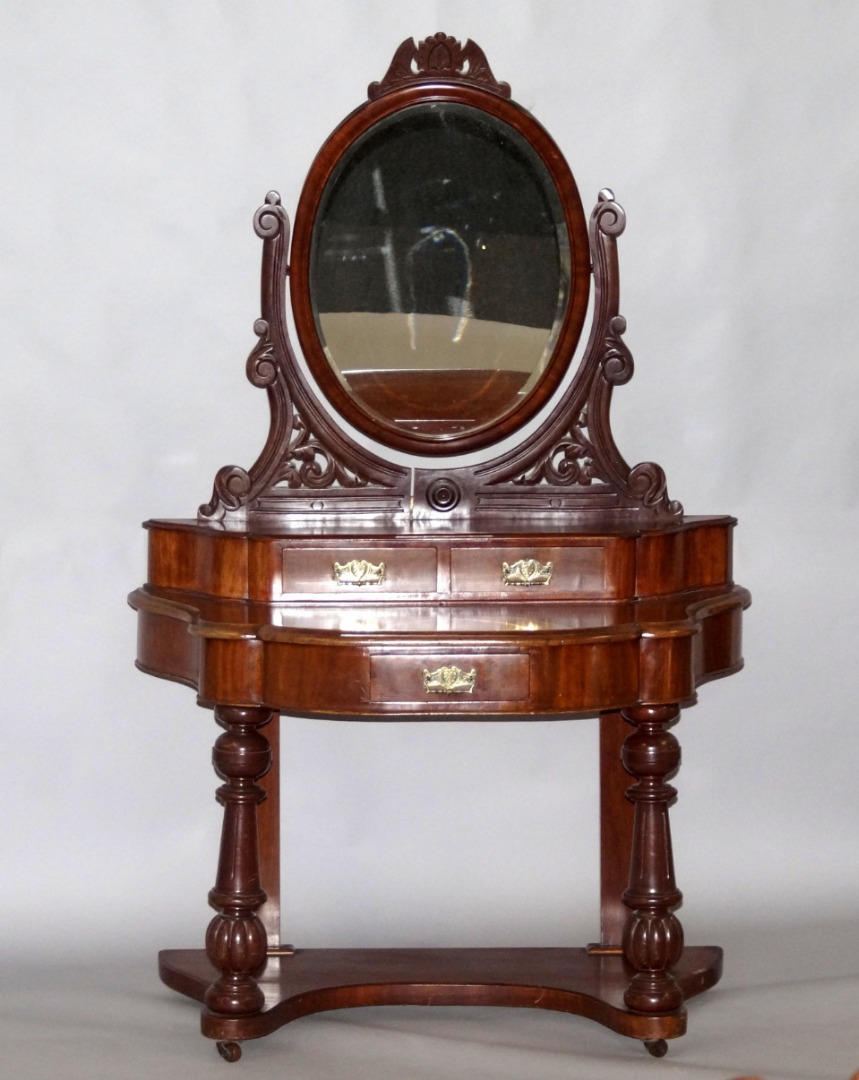 Appraisal: A Victorian mahogany Duchess dressing table the oval swing frame